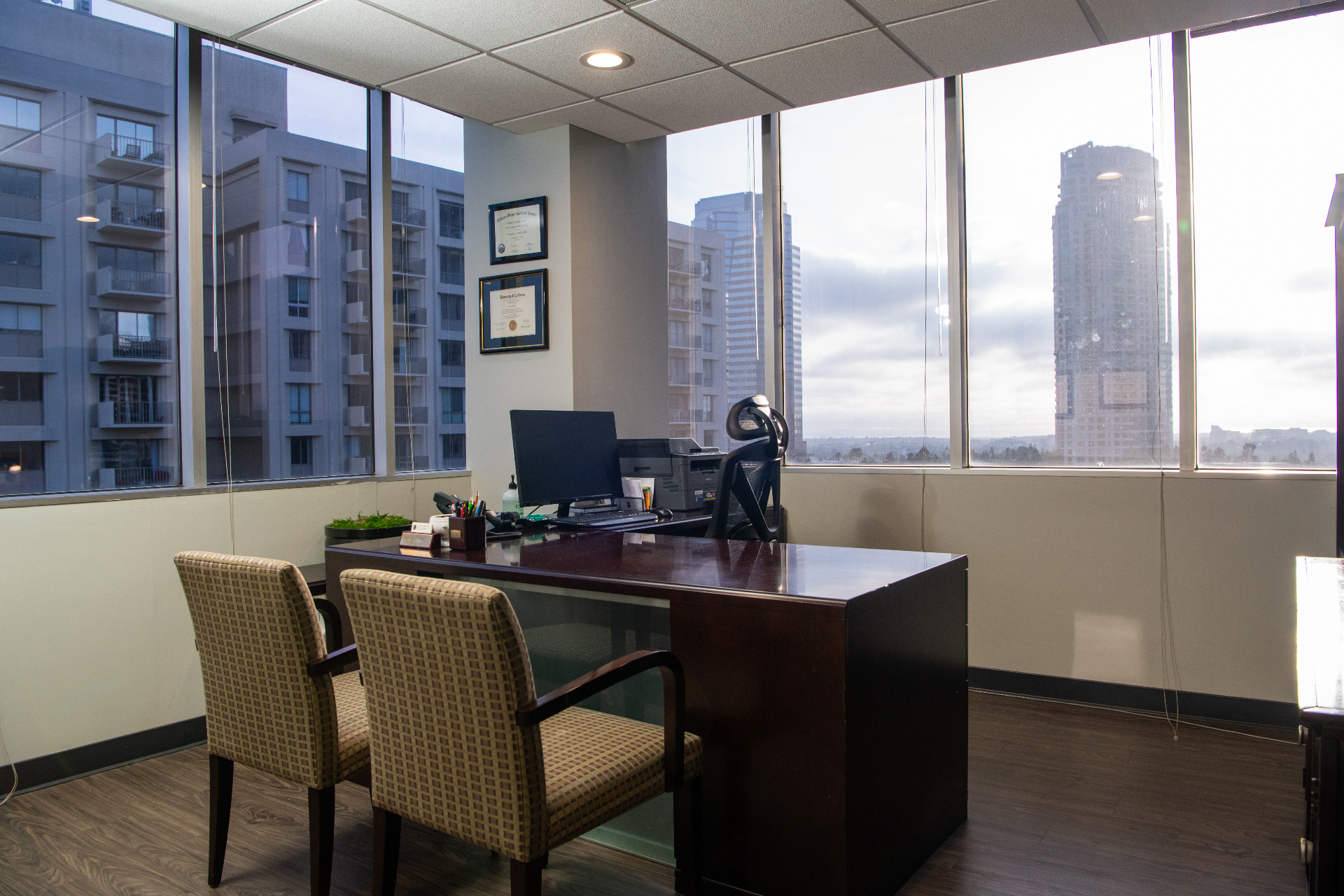 Beverly Hills Urology reception desk with front-desk staff window and skyline views