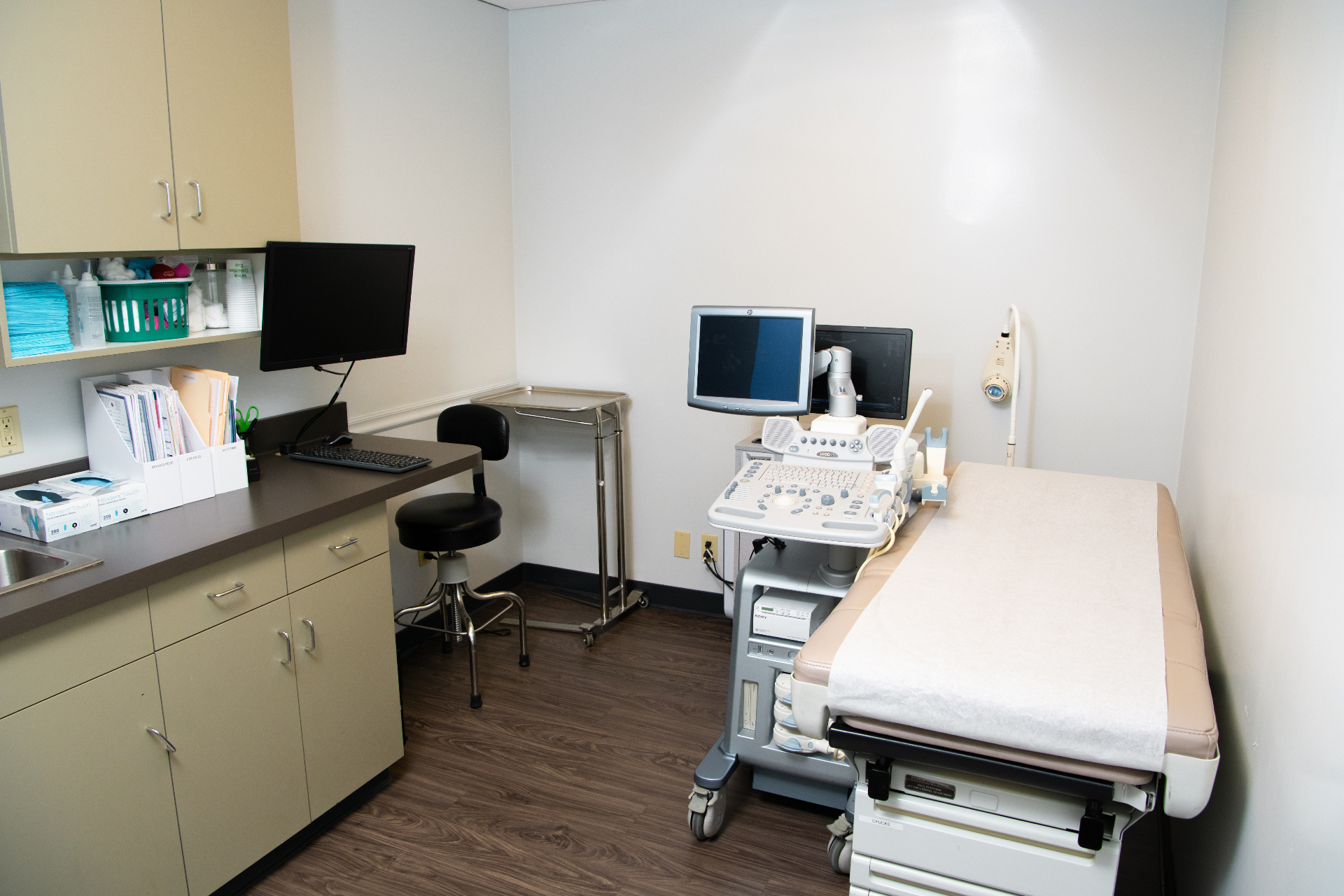 Physician office at Beverly Hills Urology with diplomas, family photos, and Los Angeles views
