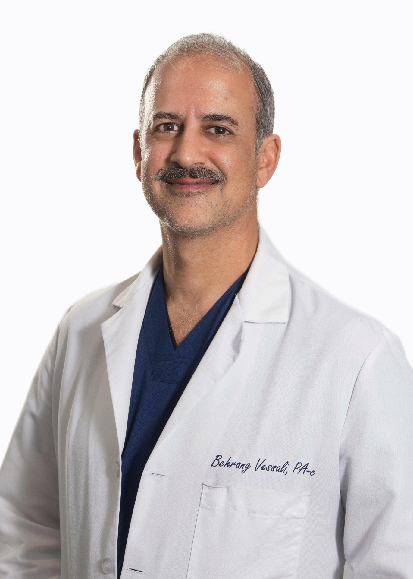 Portrait of Behrang Vessali, PA-C in a white coat