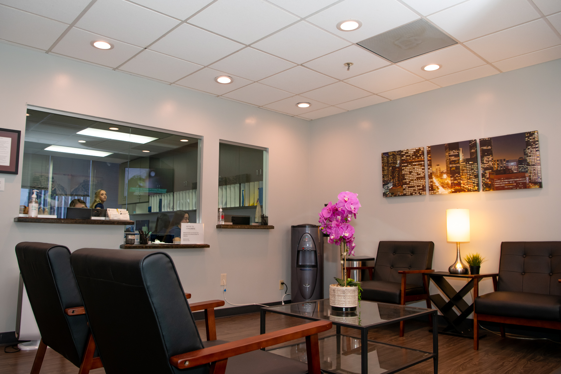 In-office procedure room at Beverly Hills Urology with exam chair, endoscopy equipment, and city views